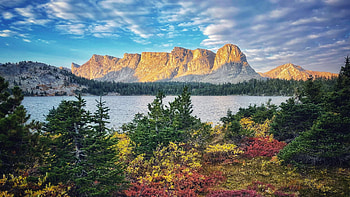 A dream-like fall sunrise deep in the Popo Agie Wilderness, Wyoming, rocks, lake, autumn, clouds, trees, sky, usa HD wallpaper