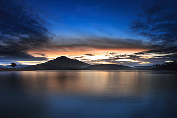 Mountains, silhouette, lake, sunset HD wallpaper