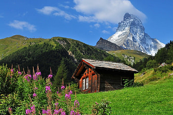 Swiss landscape, peaks, nice, Switzerland, hills, slope, house, landscape, swiss, beautiful, grass, rocks, mountain, cabin, summer, clouds, sky, mountainscape, flowers, cottage, lovely HD wallpaper