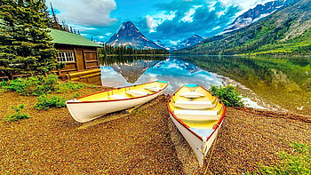 Away from it all - Glacier National Park, Two Medicine Lake, Montana, boats, clouds, sky, mountains, cabin, usa HD wallpaper