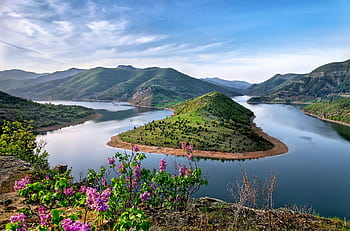 Beautiful view of the Arda River curving through lush green hills on a clear day. HD wallpaper