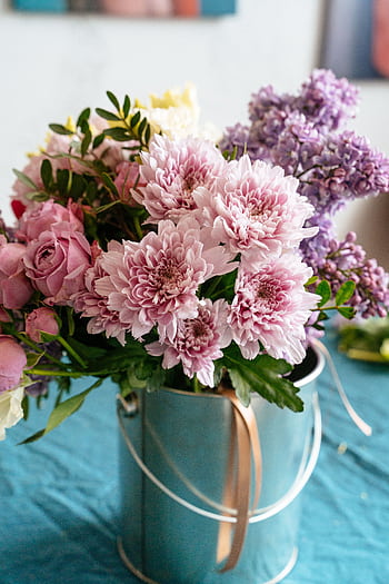 Vibrant pink and purple flowers elegantly arranged in a metal bucket. HD phone wallpaper