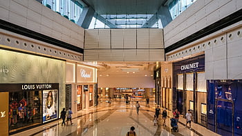 Explore the modern architecture of a luxury shopping mall in Hong Kong. HD wallpaper