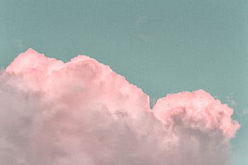 Pastel pink clouds in a clear blue sky create a serene and dreamy atmosphere. HD wallpaper