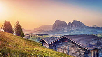 wonderful homes on an alpine meadow, cabins, meadow, mountains, haze HD wallpaper
