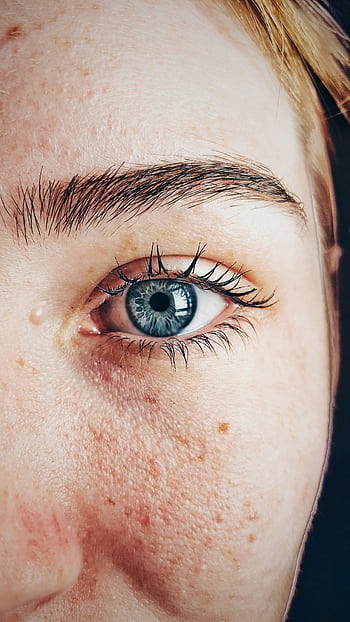 Detailed close-up of a woman's blue eye showcasing natural skin texture and eyebrow. HD phone wallpaper