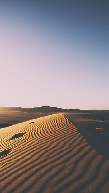 Desert sunset, Dramatic skyline, Silhouetted sand dunes, Breathtaking colors HD phone wallpaper