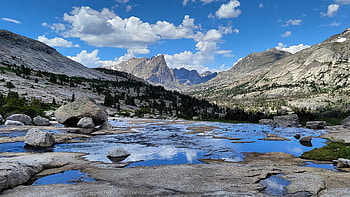 Cloud reflecting puddles in the Wind River Range, clouds, sky, rocks, mountains, stones, wyoming, usa HD wallpaper