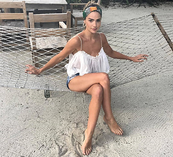 Janet Montgomery, brunette, sitting n hammock, earrings, denim shorts, white t top, spaghetti straps, fish net HD wallpaper