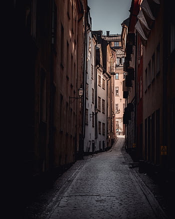 Discover the charm of a cobblestone alleyway in Södermalm, Stockholm, Sweden, perfect for city explorations. HD phone wallpaper