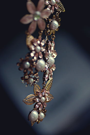 Close-up of a luxurious floral necklace featuring pearls and gemstones with a vintage charm. HD phone wallpaper