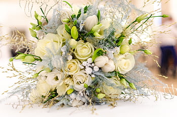 A beautiful bouquet featuring white roses and greenery perfect for weddings. HD wallpaper