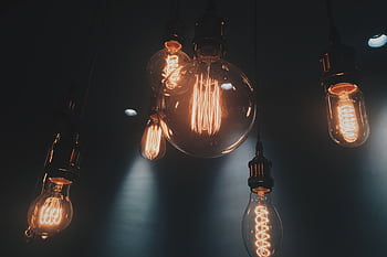Close-up of vintage Edison light bulbs glowing warmly in Shinjuku, Tokyo. HD wallpaper