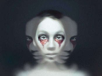 A hauntingly surreal portrait featuring abstract and eerie facial expressions. HD wallpaper