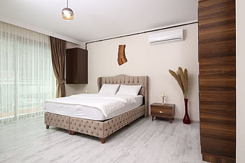 Bright and airy modern bedroom in Istanbul with minimalist design and luxury amenities. HD wallpaper