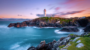 Sunset At An Irish Lighthouse, rocks, coast, ireland, sea, colors, sky HD wallpaper
