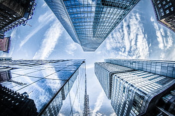 Low angle shot of modern skyscrapers in Frankfurt, showing reflections and sky. HD wallpaper