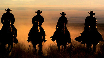 Slow-Motion-Panning-Shot-Of-Four-Cowboys-Riding- HD wallpaper