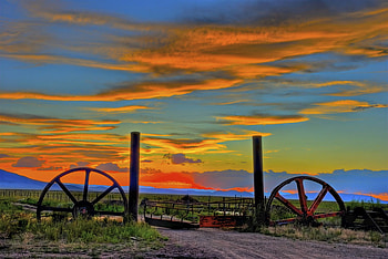 Sunset In New Mexico, New Mexico, grass, wheels, field, fence, clouds, road, sky, mountains, sunset HD wallpaper