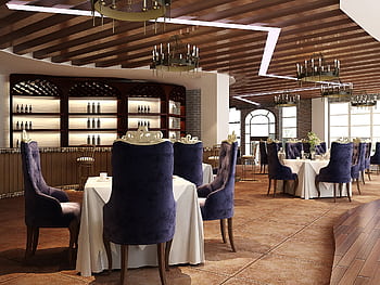 Sophisticated luxury restaurant interior featuring elegant chandeliers and plush seating, perfect for fine dining. HD wallpaper