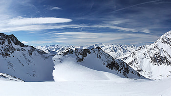 Snow Capped Rock Mountains Winter Scenery Under White Clouds Blue Sky Winter HD wallpaper