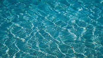 Abstract of clear blue water with delicate ripples creating a textured surface. HD wallpaper