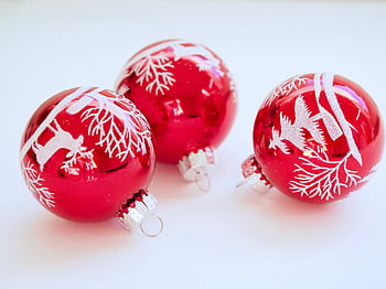 Red Christmas baubles with white festive designs perfect for holiday decor. HD wallpaper
