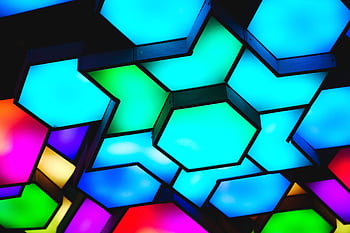 A colorful display of geometric ceiling lights creating a modern and artistic ambiance. HD wallpaper