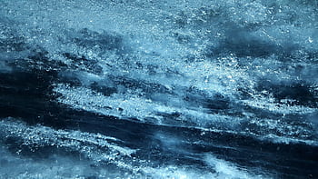 Close-up view of textured blue ice surface, capturing abstract natural patterns. HD wallpaper