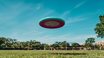 Frisbee Fun: Captivating Ultra, frisbee, flying, grass, Sports HD wallpaper