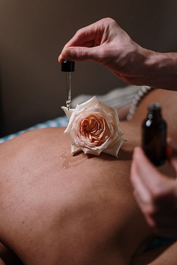 A calming spa experience with rose-infused massage oils for relaxation and skincare. HD phone wallpaper