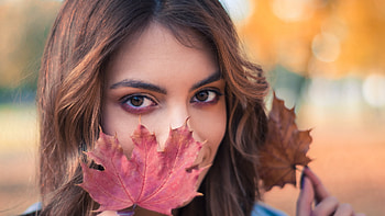 Girl Model With Autumn Leaf Standing In Colorful Blur Bokeh Background Girls HD wallpaper