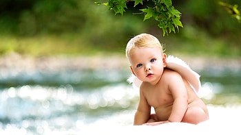 Cute Toddler Baby With Hat On Back Is Sitting On White Cloth In Blur Bokeh Background Cute HD wallpaper