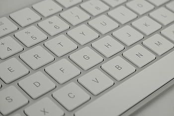 Detailed close-up of a sleek white keyboard, emphasizing modern technology. HD wallpaper