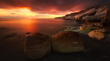 magical rocky seashore at sunset r, mist, sea, shore, r, calm, rocks, sunset HD wallpaper