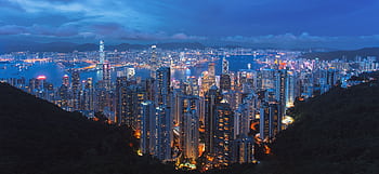 A breathtaking view of Hong Kong's illuminated skyline at night from Victoria Peak. HD wallpaper