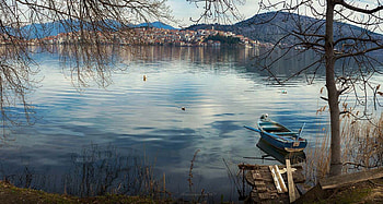 Lake of Kastoria in Greece, blue, boat, city, Greece, landscape, beautiful, Kastoria, reflection, Lake, nature, water HD wallpaper