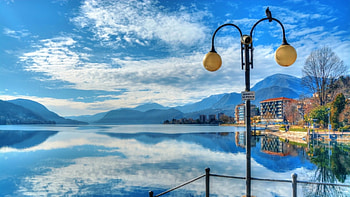 town of omegna on gorgeous lake orta r, reflection, bird, town, sky, r, lamp post, lake HD wallpaper