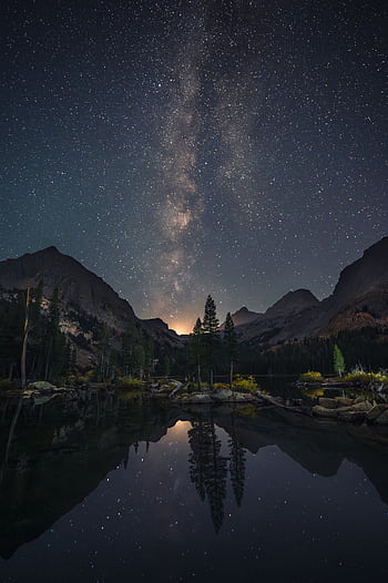 Captivating Milky Way reflection over a serene mountain lake, perfect night graphy HD phone wallpaper