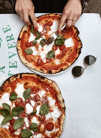 Enjoy a classic Margherita pizza in a Roman restaurant, perfect for a relaxed Italian meal. HD phone wallpaper