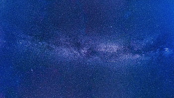 Stunning view of the Milky Way under a starry night sky, showcasing the universe's grandeur. HD wallpaper