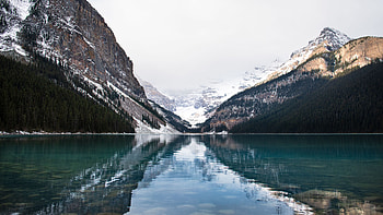 Beautiful Scenery Rock Mountains Green Trees Slope With Snow Reflection On Lake Nature HD wallpaper
