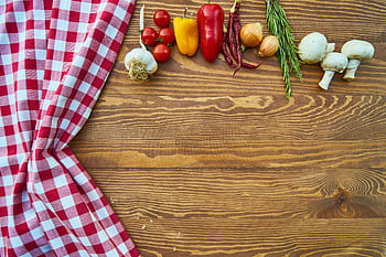 Fresh vegetables and spices on a rustic wooden table with checkered cloth. HD wallpaper