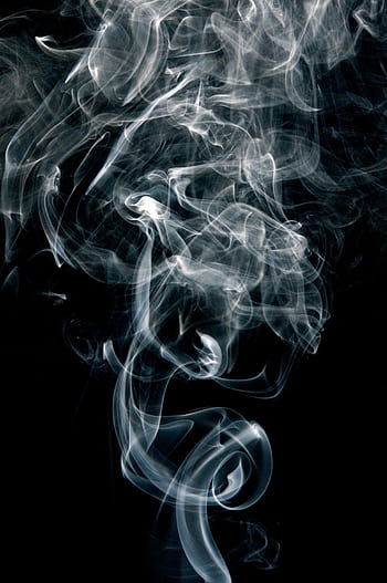 Intricate patterns of swirling smoke on a black background, creating an abstract visual. HD phone wallpaper