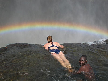 Victoria Falls, rainbow, man, waterfall, bikini, nature, woman, mountain HD wallpaper