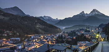 Scenic twilight view of Berchtesgaden town nestled in the Bavarian Alps with snow-capped peaks. HD wallpaper
