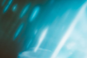 A vibrant and dynamic abstract blue gradient background with smooth textures and glowing effects. HD wallpaper