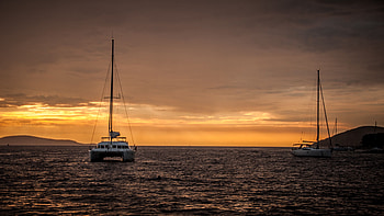 Boat Sail Ocean Water Waves Mountains Silhouette Background Sunset Nature HD wallpaper