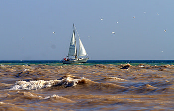 Brown Waters, waves, brown, sand, choppy, blue grey, sail, sky, sailboat HD wallpaper