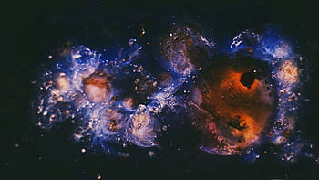 Vivid depiction of a cosmic nebula with swirling colors, ideal for space enthusiasts. HD wallpaper